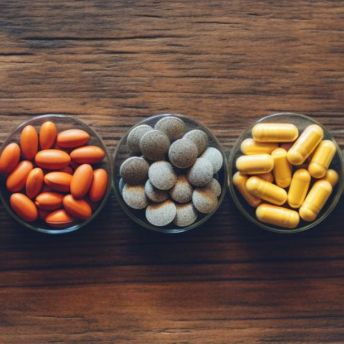 supplements on a wooden table