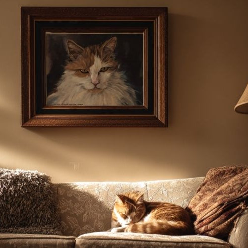 A portrait of a cat with the cat laying in front of it