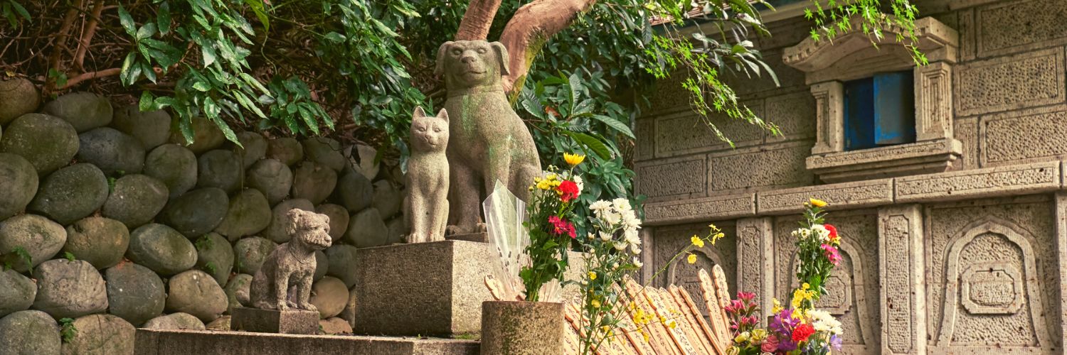 Pet urns for cats with statue memorials in a Japanese park